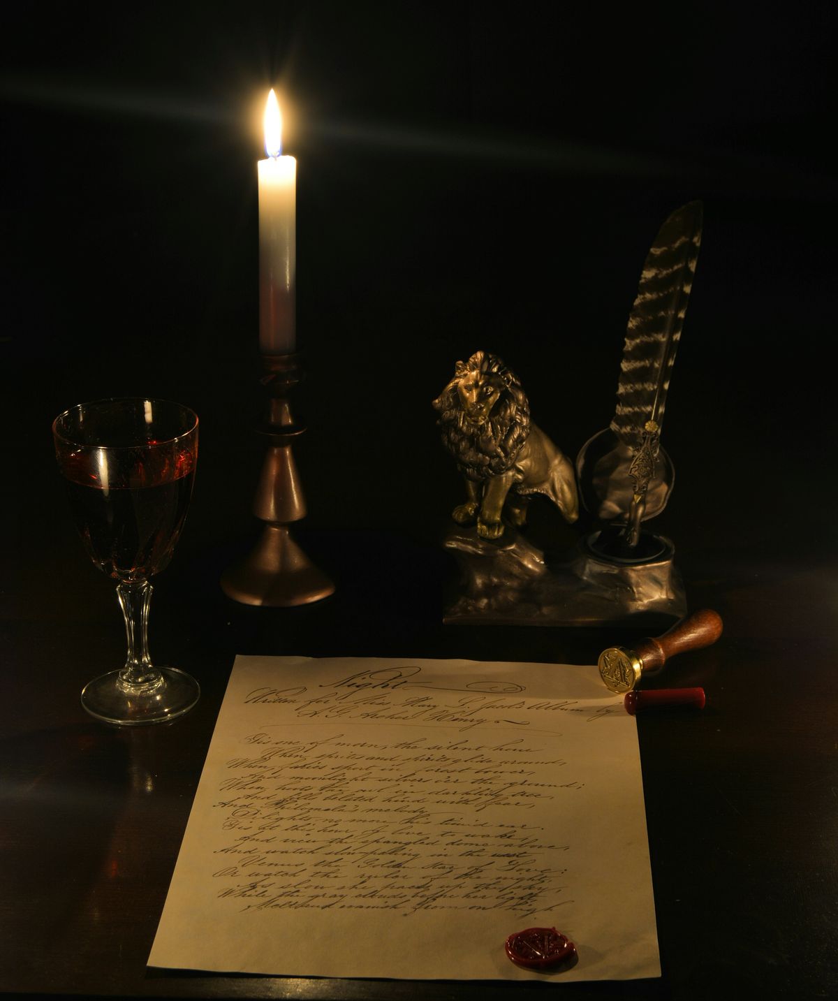 A candlelit writer's desk with quill, manuscript, and wax seal
